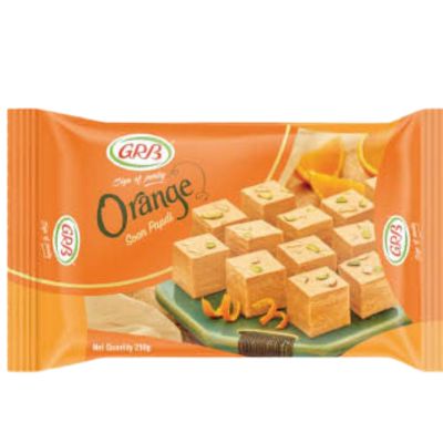 A pack of GRB Soan Papdi Orange, a vibrant orange-flavored Indian sweet.