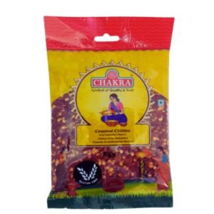 Chakra Crushed Chillies 100g, red chilli flakes in a clear package.