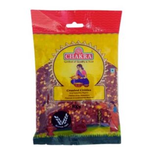 Chakra Crushed Chillies 500g, red chilli flakes in a clear package.